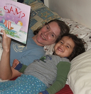 Mama and Amie reading a bedtime story